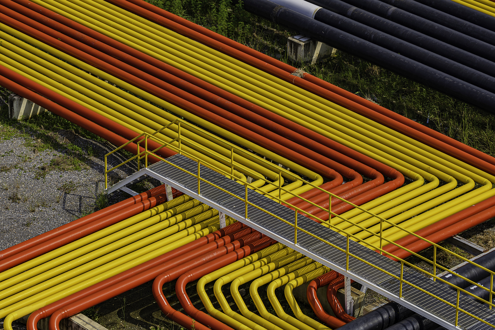 Pipe line oil and gas yellow and red valves at gas plant pressur